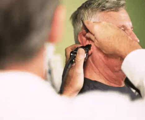 Man getting his hearing tested by an audiologist